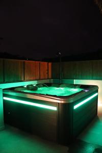 a hot tub with blue lights in a room at Blue Lagoon in Baie Lazare Mahé