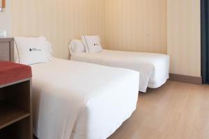 Postel nebo postele na pokoji v ubytování Hotel Ibersol Atrio del Mar