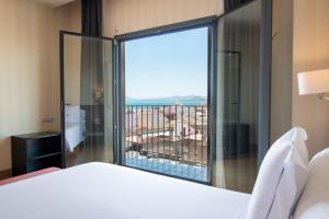 Postel nebo postele na pokoji v ubytování Hotel Ibersol Atrio del Mar