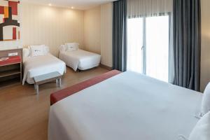 Postel nebo postele na pokoji v ubytování Hotel Ibersol Atrio del Mar