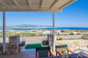 a patio with a view of the ocean at Gregos house in Antiparos