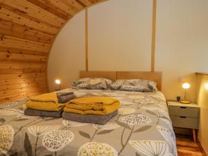 a bedroom with a bed with two towels on it at Barbondale in Carnforth