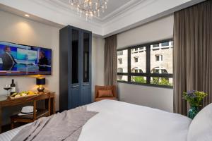 Letto o letti in una camera di The David Story Boutique