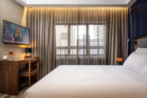 Letto o letti in una camera di The David Story Boutique