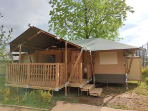 a gazebo with a porch and a tent at TEIRABOA BASE CAMP in Arzúa