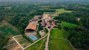 an aerial view of a building on a field at Locanda Cossetti Ranch Winery in Incisa Scapaccino