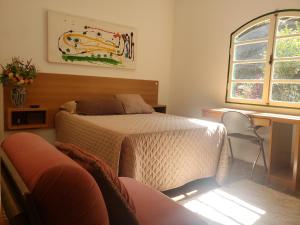 Säng eller sängar i ett rum på Sitio Natividade
