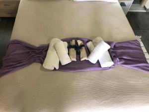 a bed with three pairs of socks on it at Thealassa in Kalliópi