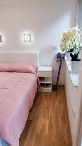 a bedroom with a bed and a desk with a laptop at Apartment Ozare in Slovenj Gradec