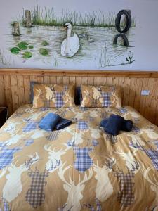 A bed or beds in a room at Dulrush Fishing Lodge and Guest House