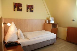 Postel nebo postele na pokoji v ubytování TOP Hotel Amberger