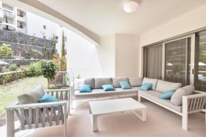 a living room with a couch and a table at Ancor 0-1 POOL VIEW 2B in Palm-Mar