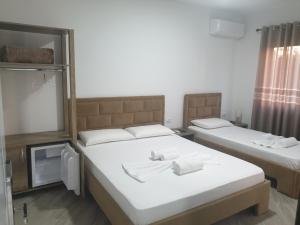 Postel nebo postele na pokoji v ubytování ELMA Guest House
