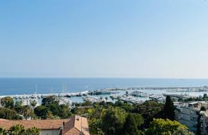 a view of a harbor with boats in the water at Special Home VISTA MARE e Parcheggio privato in Sanremo