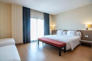 Postel nebo postele na pokoji v ubytování Hotel Ibersol Atrio del Mar