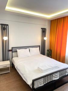 Postel nebo postele na pokoji v ubytování Ora Bella Hotel