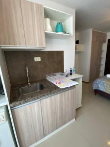 Kuchyň nebo kuchyňský kout v ubytování Estudio elegante y cálido + 6 fotografií