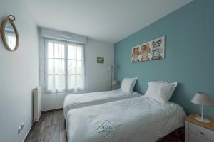 En eller flere senge i et værelse på Central park Disneyland BMYGUEST