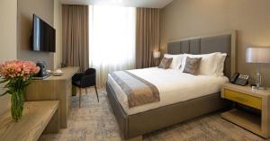 Rúm í herbergi á Sphera by Stellar Hotels, Yerevan