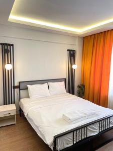 Postel nebo postele na pokoji v ubytování Ora Bella Hotel