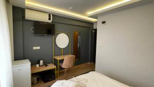 Postel nebo postele na pokoji v ubytování Ora Bella Hotel