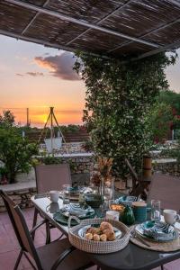a table with food on top of a patio at Villa Zoi in Koríthion