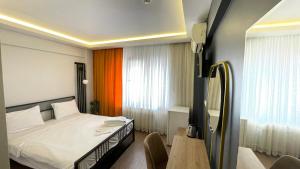 Postel nebo postele na pokoji v ubytování Ora Bella Hotel