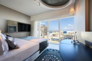 TV o dispositivi per l'intrattenimento presso Port Tower by Isrotel Design