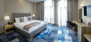 Rúm í herbergi á Sphera by Stellar Hotels, Yerevan