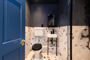 a bathroom with a toilet and a sink at 30 Castle Street Deluxe Apartments in Edinburgh