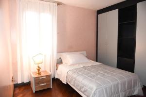 A bed or beds in a room at Dimora Noemi