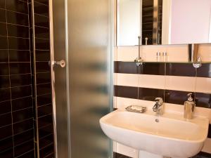 a bathroom with a sink and a mirror at B&B Sul Corso in Salerno +37 photos