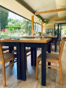 a dining room with a large wooden table and chairs at De Novo e d'Antico in Cori