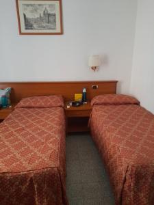 Letto o letti in una camera di Incantoromano guest house