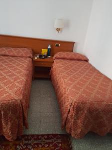 Letto o letti in una camera di Incantoromano guest house