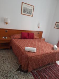 Letto o letti in una camera di Incantoromano guest house