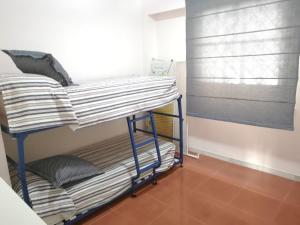 Postel nebo postele na pokoji v ubytování PLANTA BAJA ACCESO DIRECTO A LA PLAYA