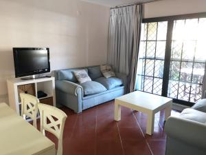 Posezení v ubytování PLANTA BAJA ACCESO DIRECTO A LA PLAYA