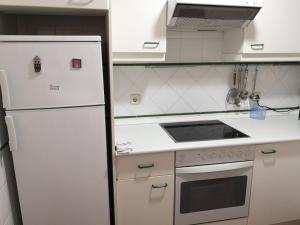 Kuchyň nebo kuchyňský kout v ubytování PLANTA BAJA ACCESO DIRECTO A LA PLAYA + 6 fotografií