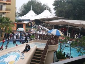a group of people in a pool at a resort at Theme Park View Studio @ Gold Coast in Banting