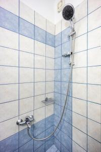 a shower with a hose in a bathroom at SK Suites Thassos in Skala Potamias +108 photos