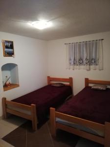 Posteľ alebo postele v izbe v ubytovaní Apartman Cvita