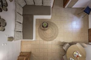 an overhead view of a bathroom with a toilet at Mantelena studios & family apartments in Pollonia +59 photos