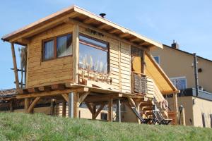 a house on a wooden structure on top of a hill at Danubio an der Donau - Donau-Resorium in Donauwörth
