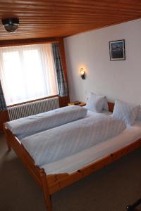 Voodi või voodid majutusasutuse Hotel Posta toas