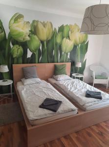 Postel nebo postele na pokoji v ubytování Das Tulpen Apartment