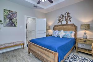a bedroom with a bed with a blue bedspread at Gorgeous Edinburg Getaway about 2 Mi to UTRGV! in Edinburg