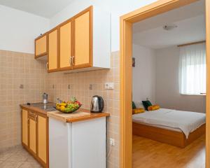 Kuchyň nebo kuchyňský kout v ubytování Apartments Baresic