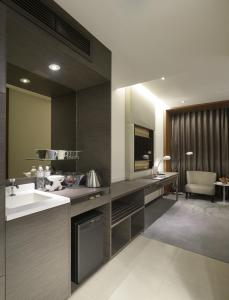 Kuchyň nebo kuchyňský kout v ubytování Golden Tulip Glory Fine Hotel