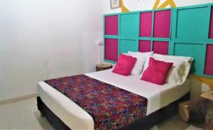 A bed or beds in a room at vt backpackers neiva tour and experiences